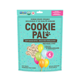 A package of Cookie Pal soft baked birthday cake flavored dog treats with balloons and a party theme.