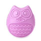 Purple owl-shaped dog toy slow feeder for puppies on a white background