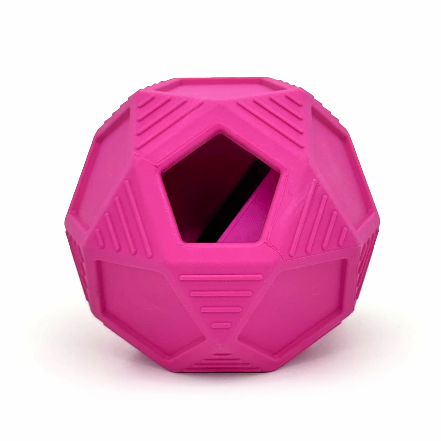 Hot pink rubber disco ball dog toy with treat dispensing hole, geometric texture design