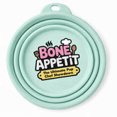 Light blue silicone DuraPaw travel collapsible dog bowl dish with Bone Appetit logo printed on a white background