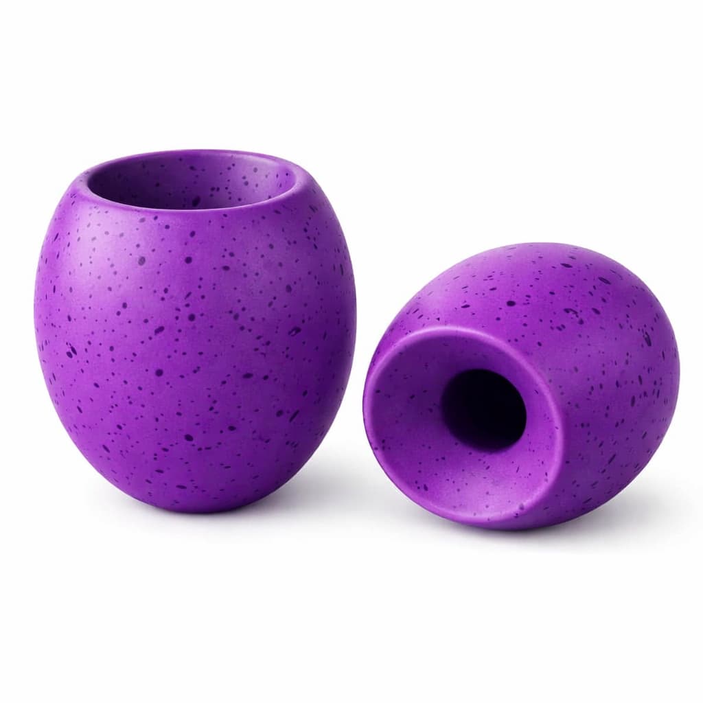 Two purple textured DuraPaw durable grape enrichment treat dispensing dog toys on a white background