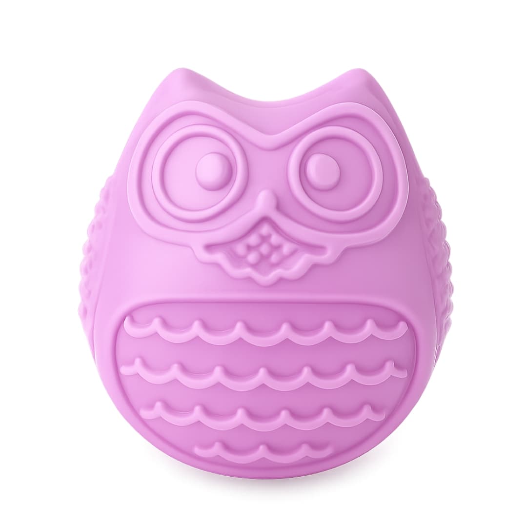 Purple owl-shaped dog toy slow feeder for puppies on a white background