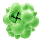 Green rubber textured ball dog toy with a central treat dispensing hole on a white background